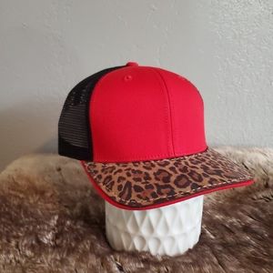 Ball cap with hand-sewn leather patch on brim